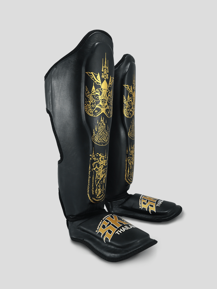 SKS Empire Schienbeinschoner - Sak Yant - Echtes Leder - Schwarz / Gold